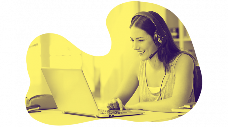 An image of woman with laptop and headset in the context of how to teach English online